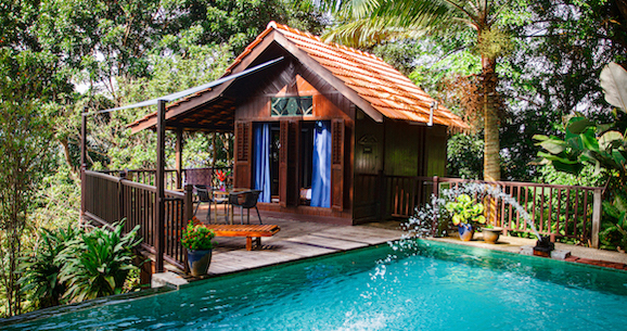 A pool surrounded by houses.